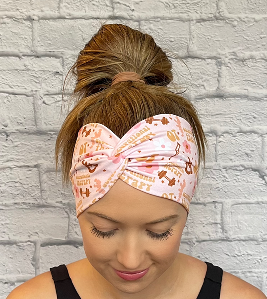 Woman with hair in bun wearing wide, twisted, pink headband with print- OT, occupational therapy with flowers, crutches, a wheelchair, and weights.