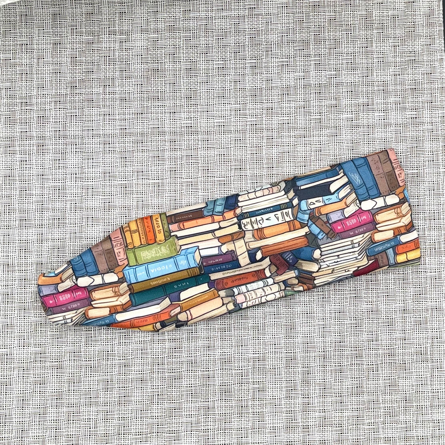 Stretchy, book print headband.