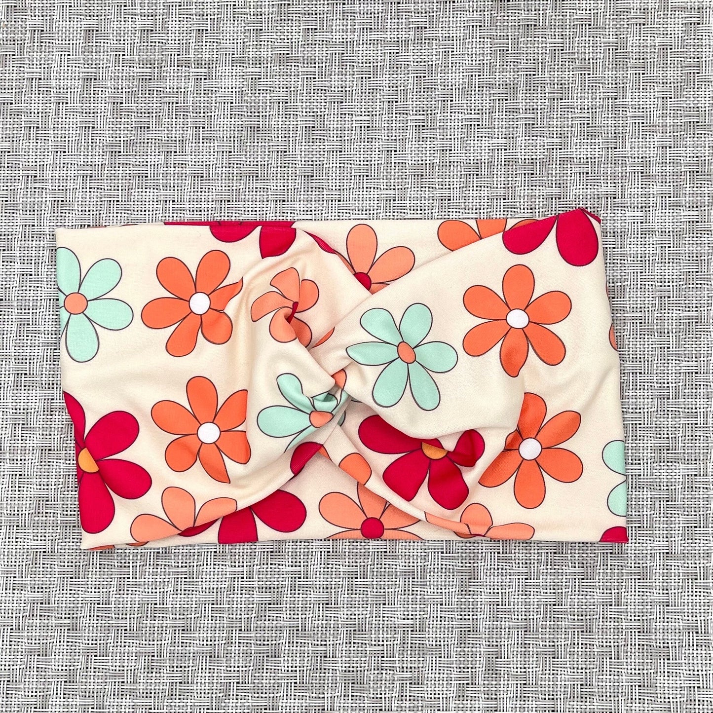 Floral headband on a textured gray background