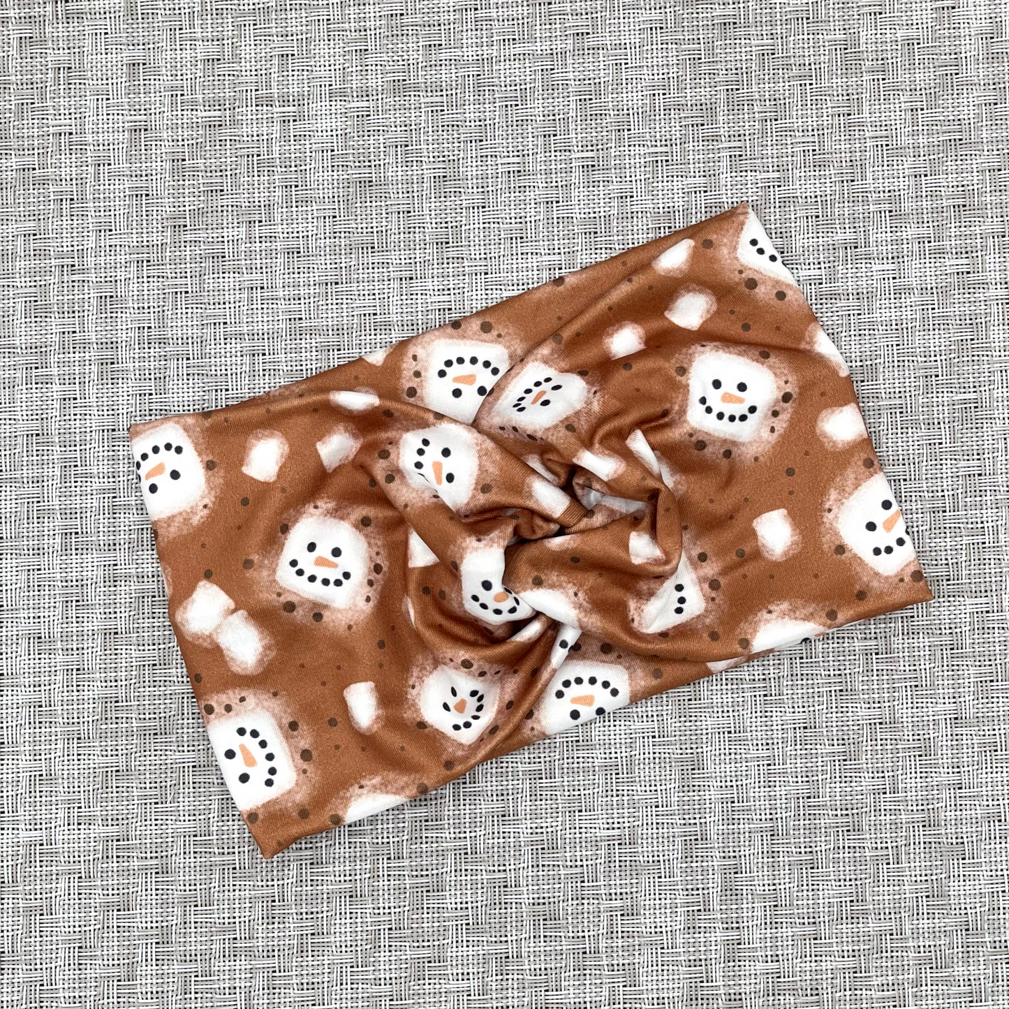Brown, wide, twisted headband with white snowman hot chocolate print.