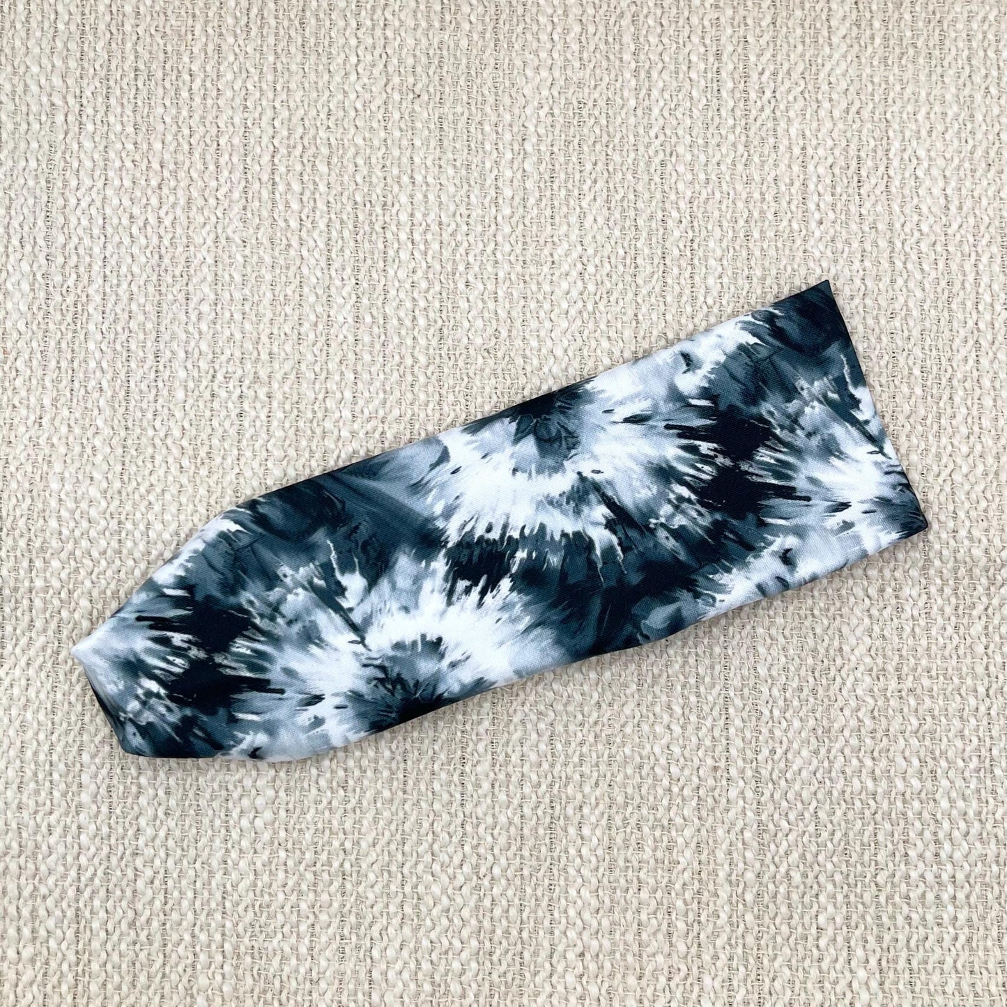 Flat, stretchy, black and white tie dye headband.