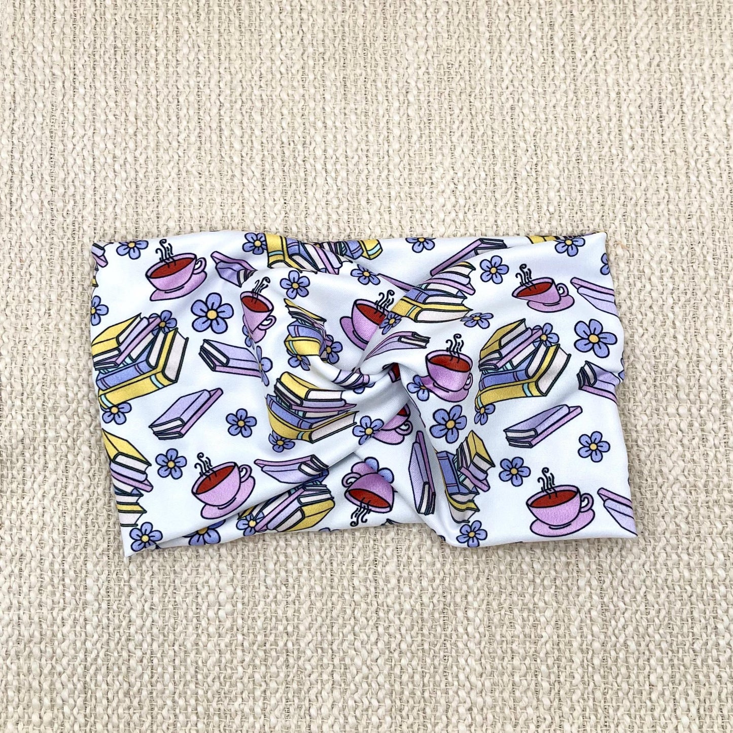 Wde, twisted, white headband with coffee, flower,and book print.