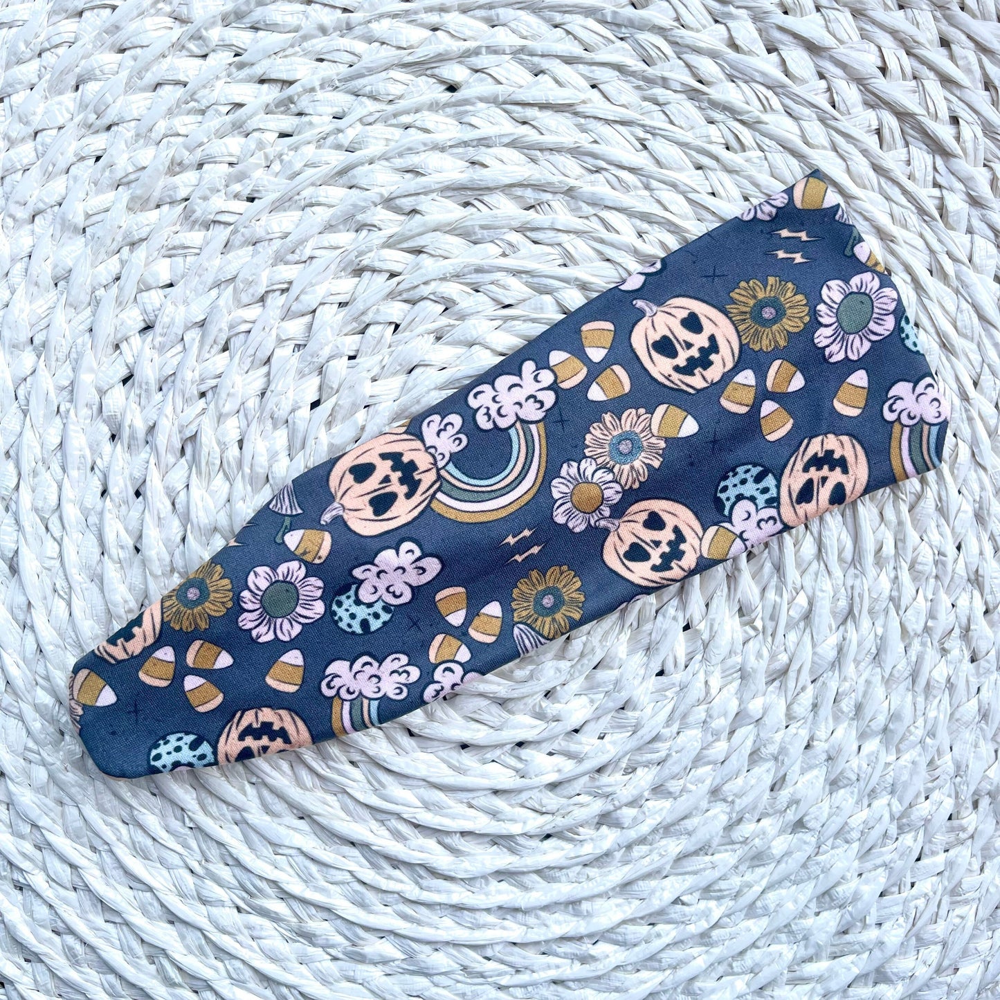flat, stretchy, gray headband with halloween theme print