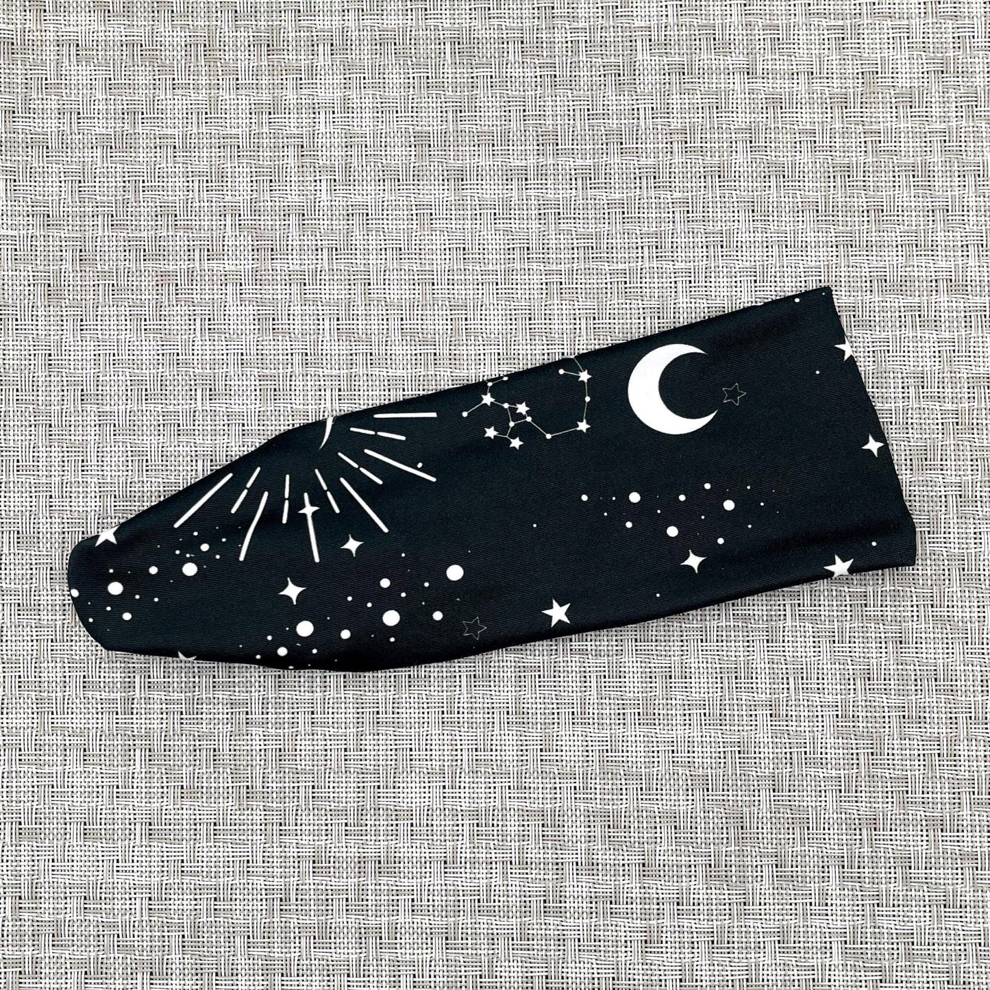 Black headband with white space/galaxy theme print.