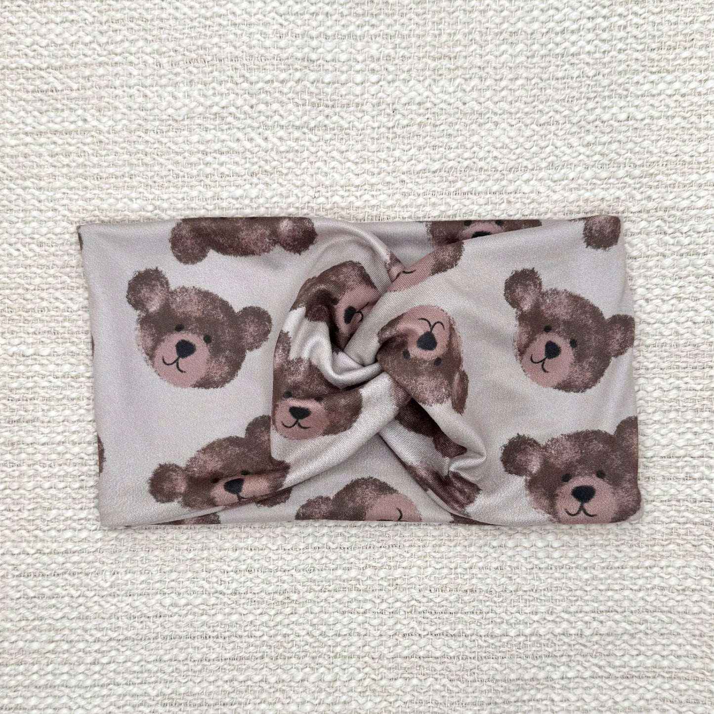 Wide, twisted headband in brown with teddy bear print.