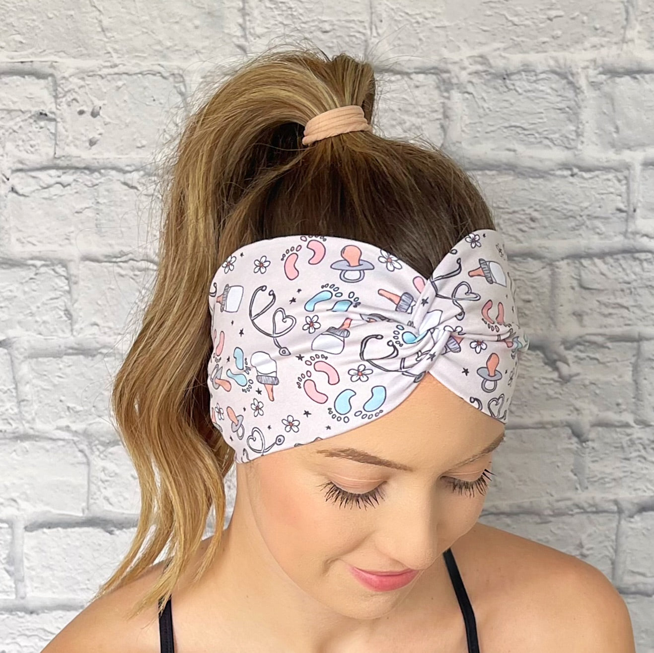 Tan headband with baby theme print