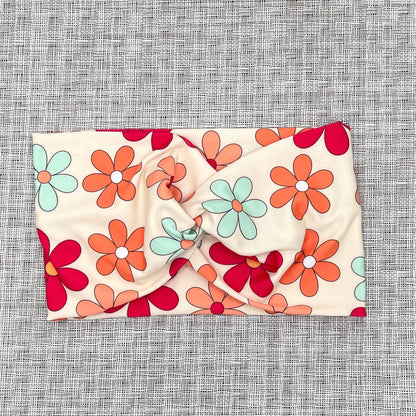 Floral headband on a textured gray background