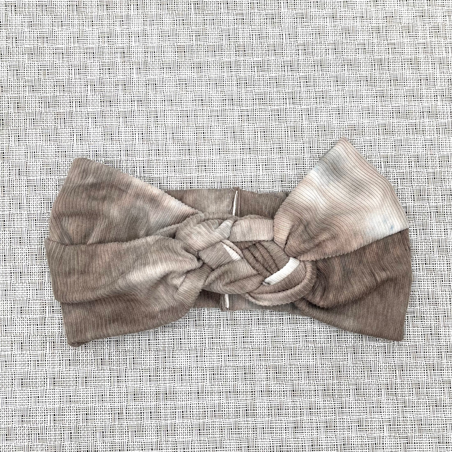 Brown Ribbed Tie Dye Sailor Knot Headband on gray background.