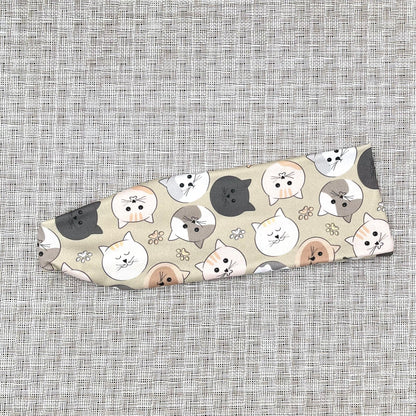 Headband with cat pattern on a textured gray background