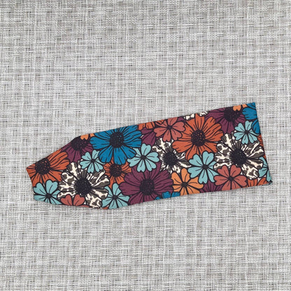 Floral patterned headband on a textured gray background