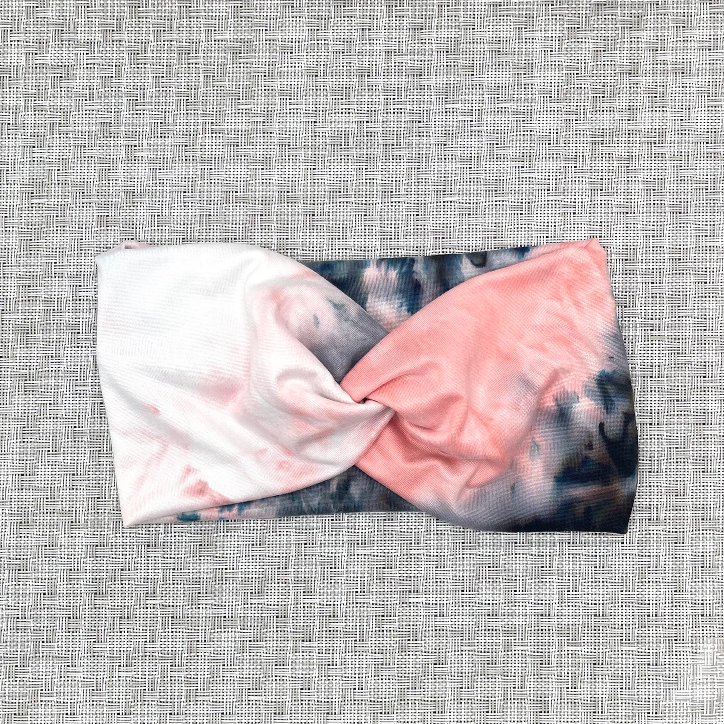 Wide, twisted, pink, white, and gray/black tie dye headband.