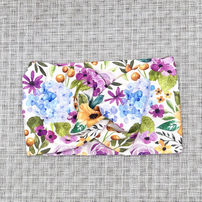 Floral patterned headband on a textured gray background