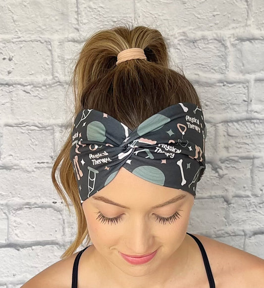 black headband with print "physical therapy" and physical exercise and therapy related items