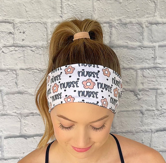 white headband with "nurse", flowers, and polka dot print in blue and tan