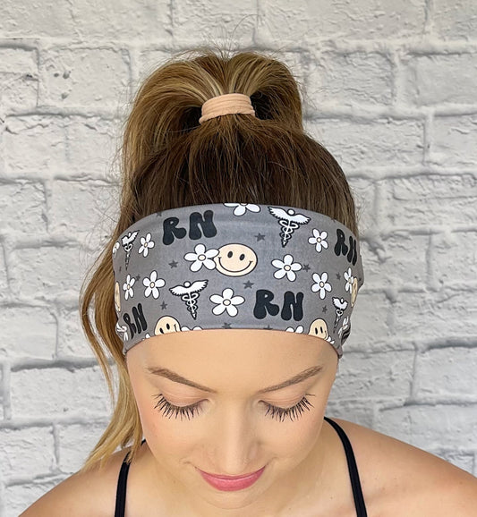 gray headband with "RN", flowers, smiley faces