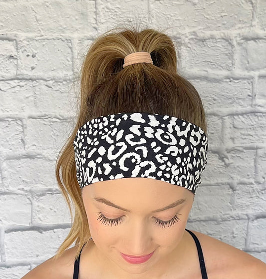 black headband with white leopard theme print