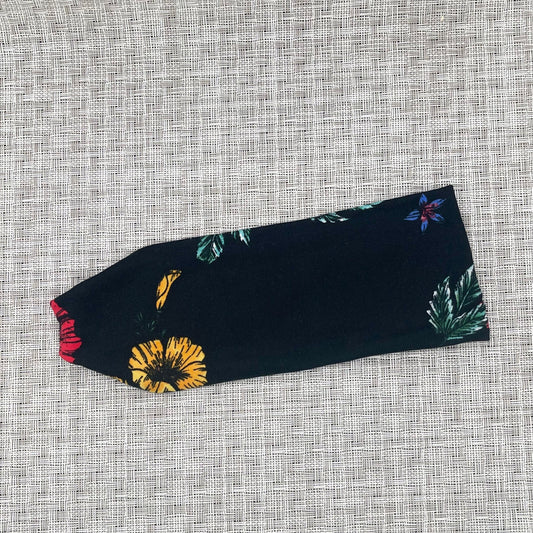 black headband with purple, red, yellow, and blue flowers