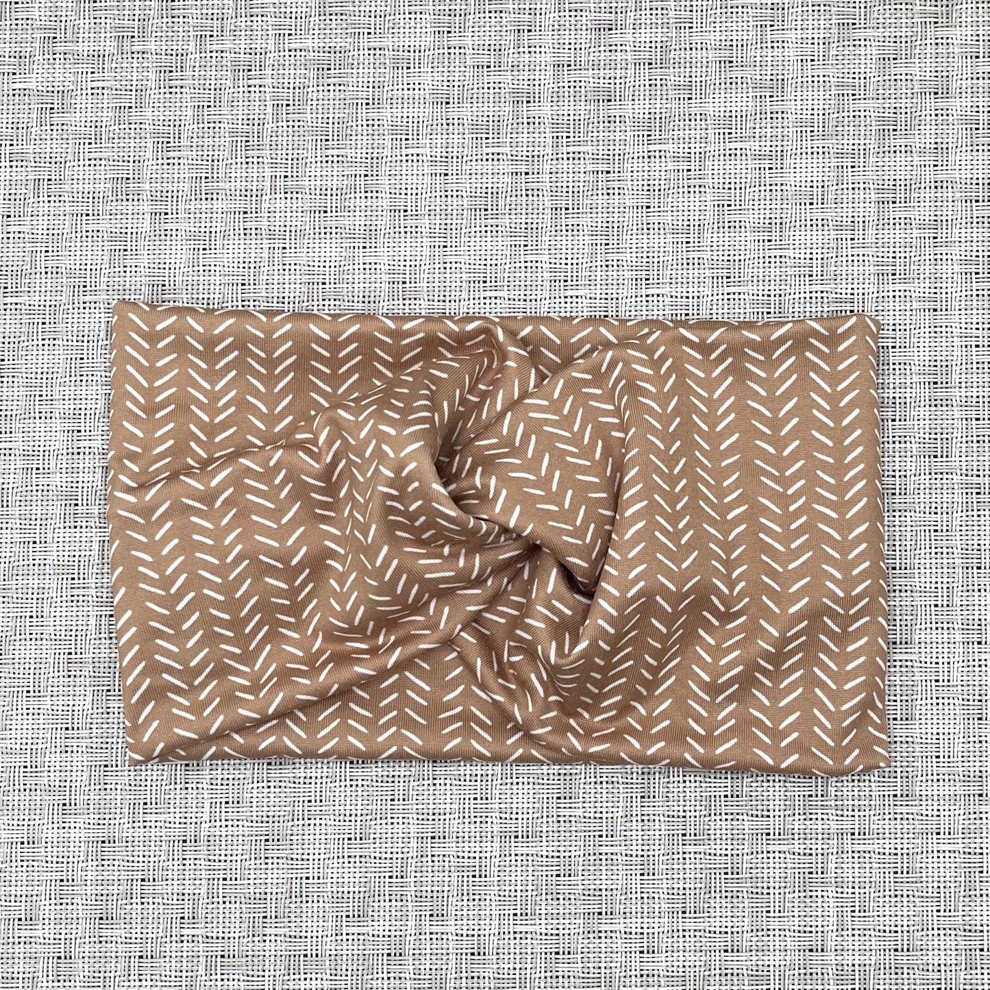 brown wide twist headband with white patterned lines