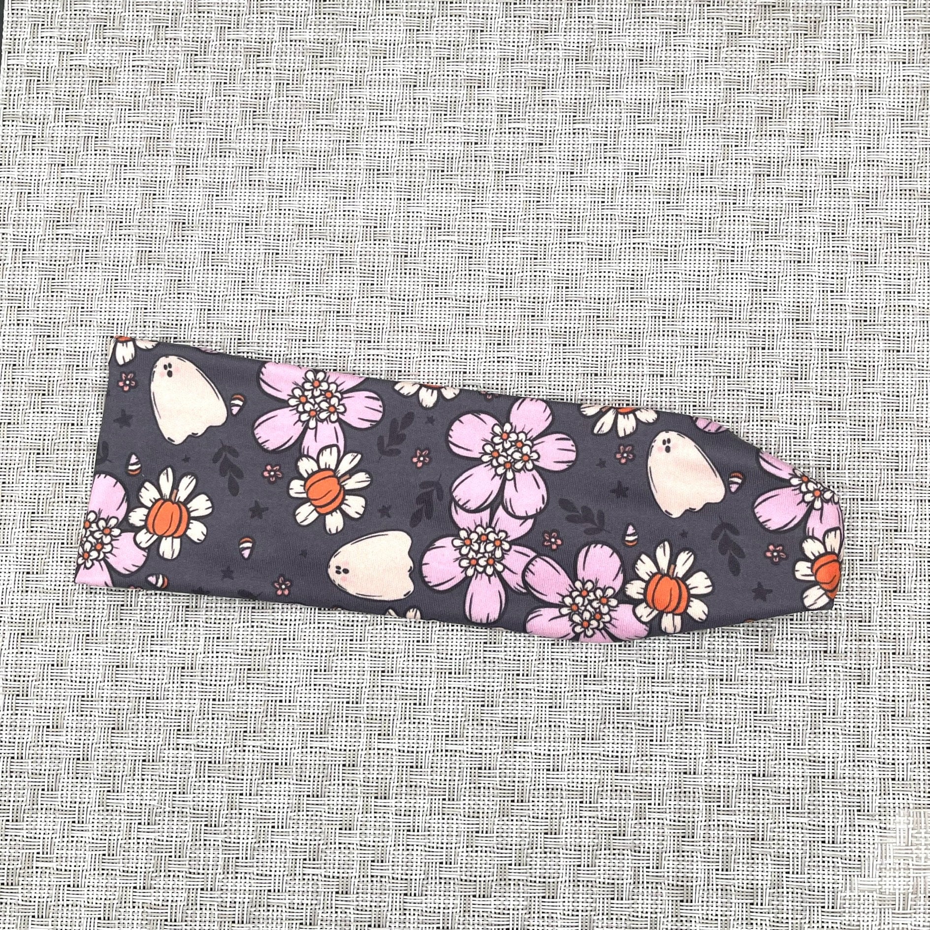 gray headband with white and purple flowers, pumpkins, and ghosts