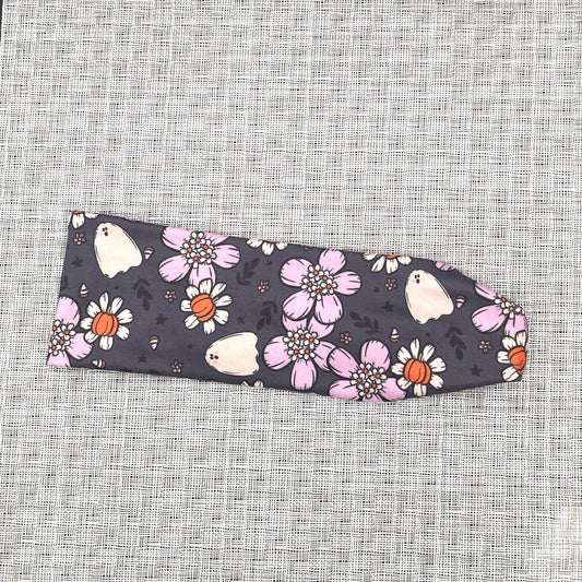 gray headband with white and purple flowers, pumpkins, and ghosts