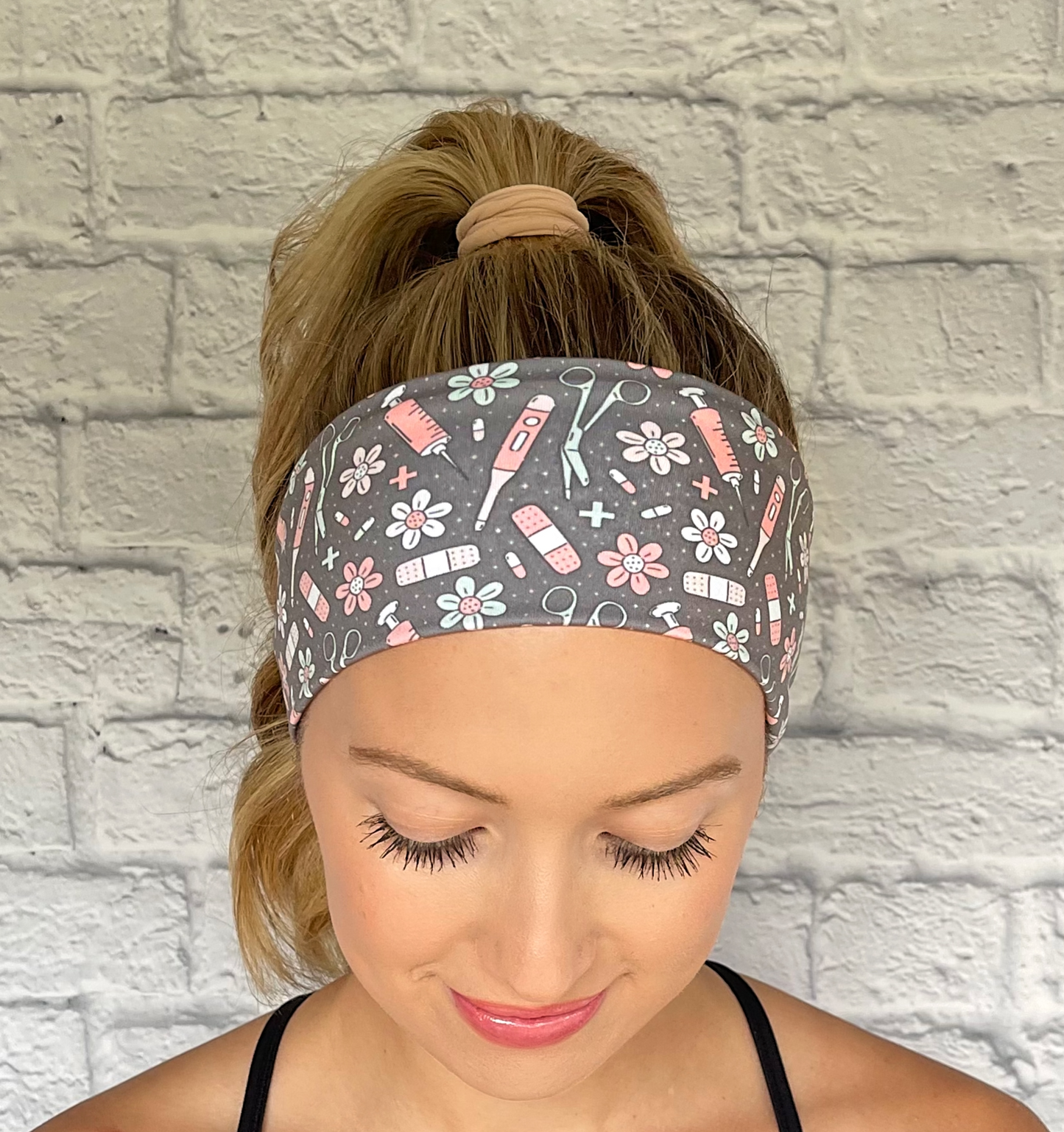 gray headband with pink, white, and seafoam green color medical theme print