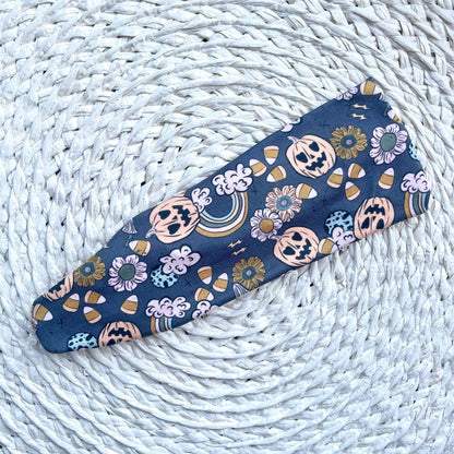 flat, stretchy, gray headband with halloween theme print