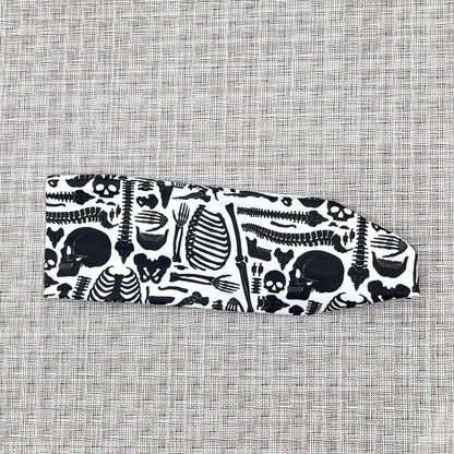 white headband with black skeleton print