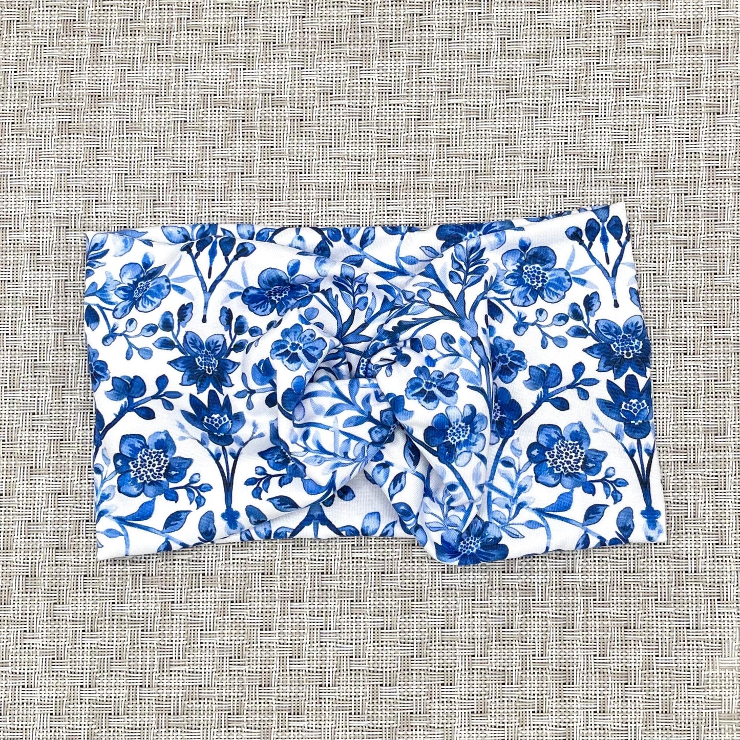 white wide twist headband with blue floral print