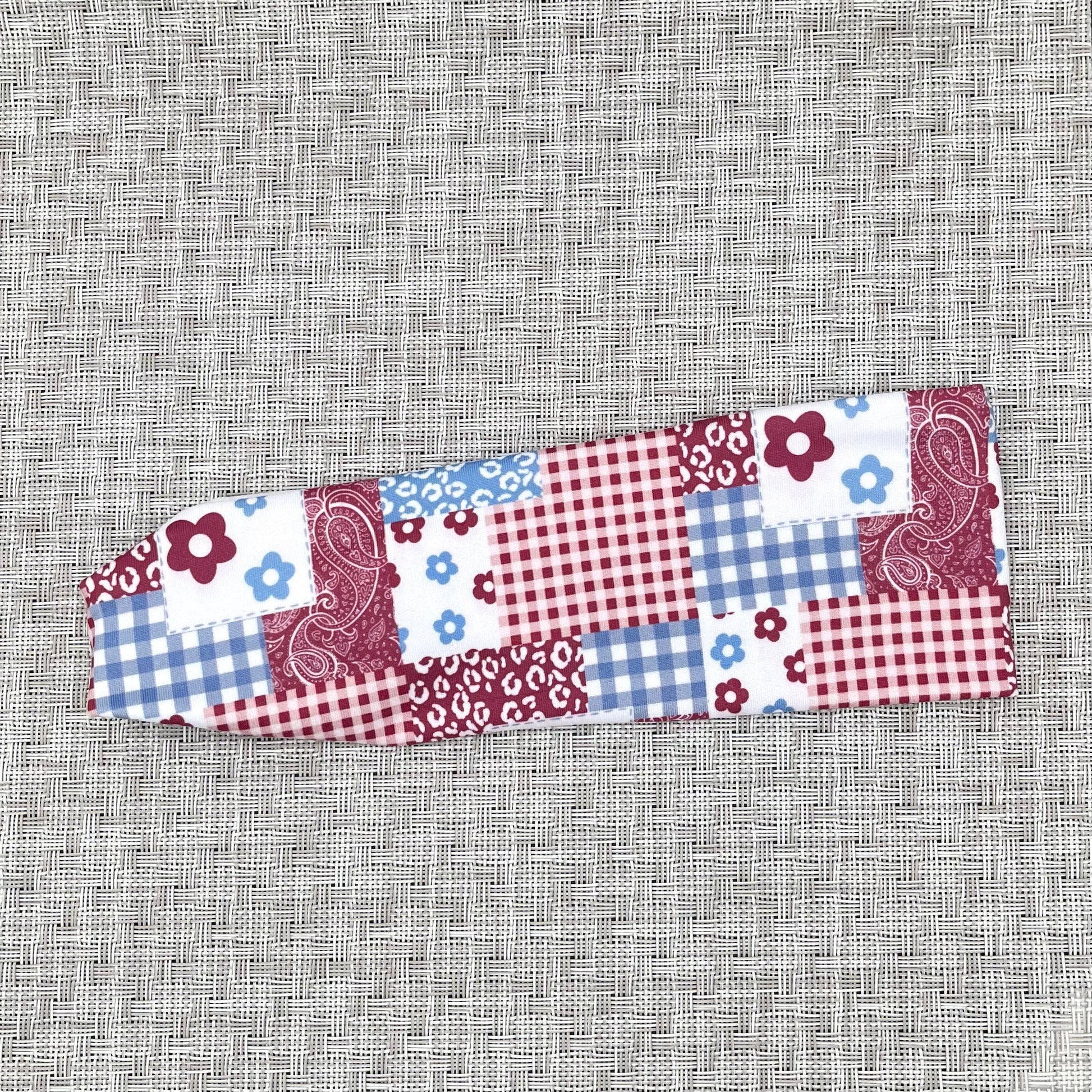 quilted pattern on headband with red, white, and blue. Contains checker print with bandana, plaid, flowers, and checkers