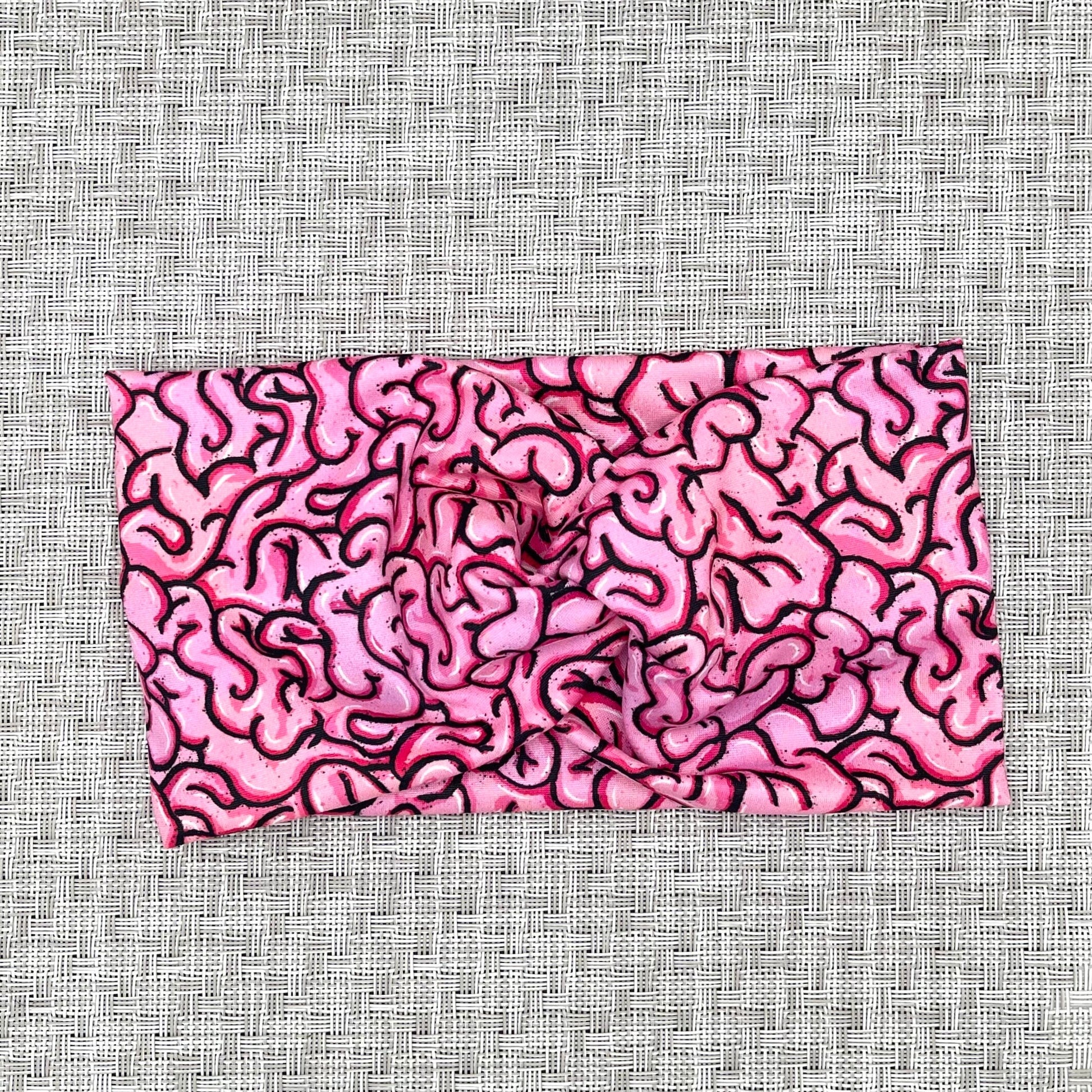 pink wide twist headband with brain print