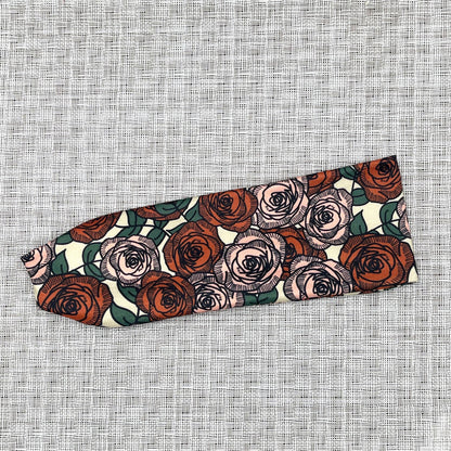 Flat, stretchy headband with rose print.