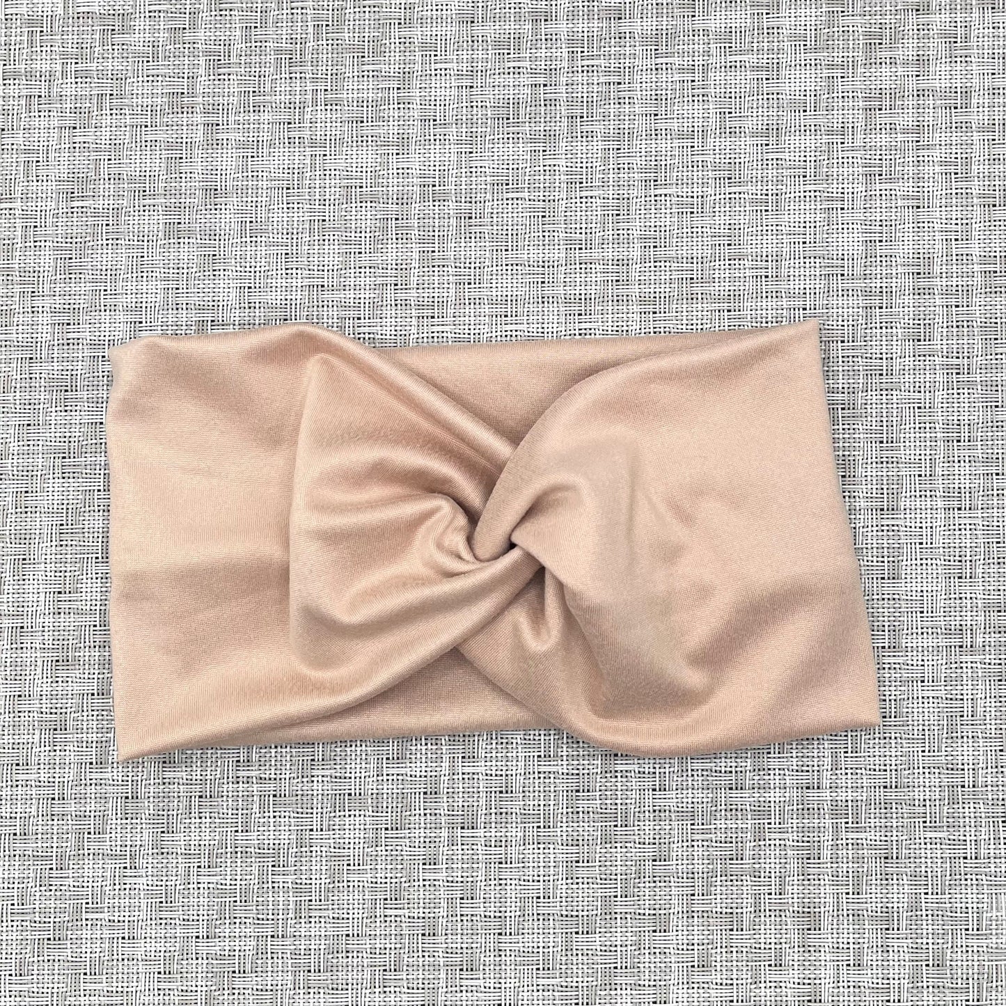 wide twist headband in tan/pink color