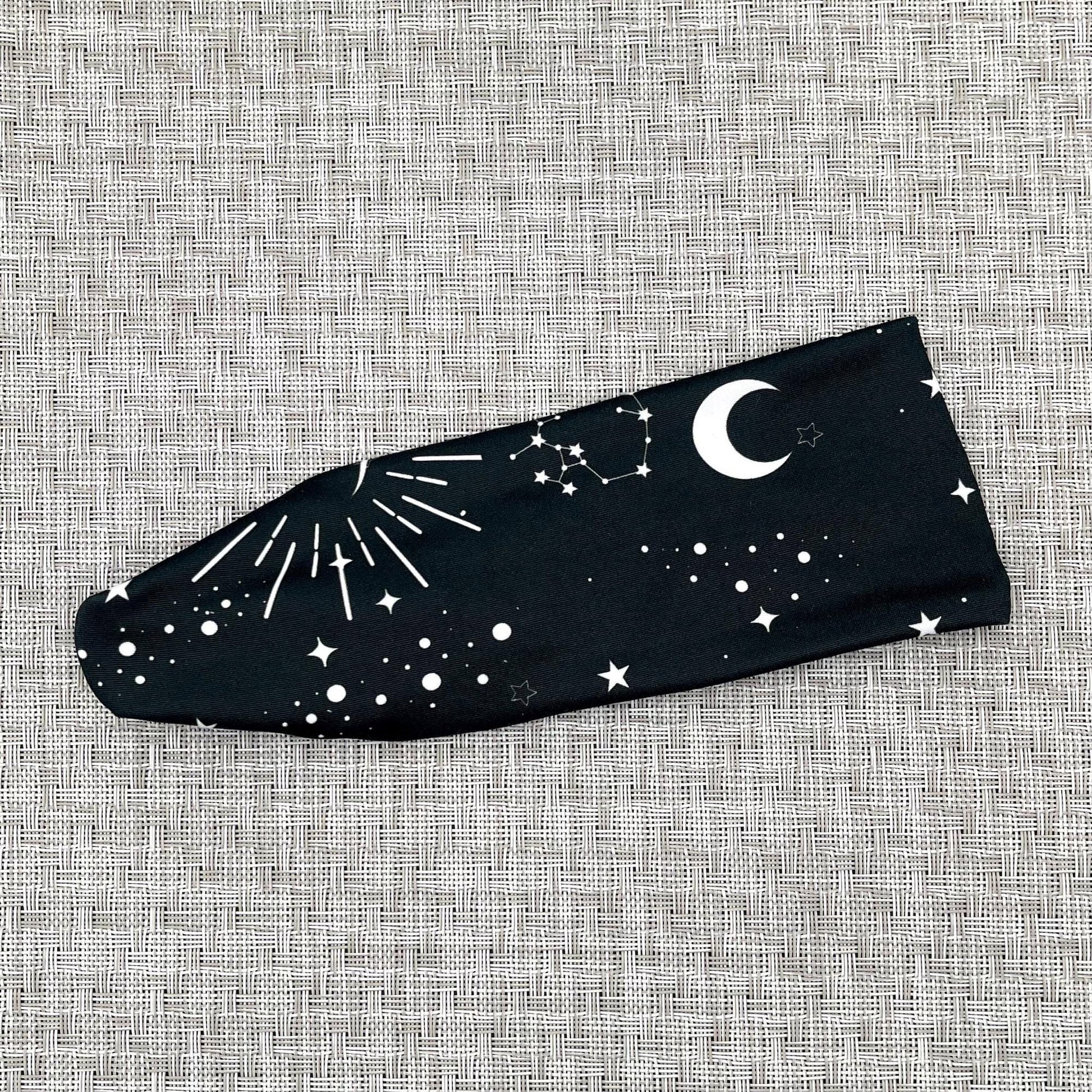Black headband with white space/galaxy theme print.