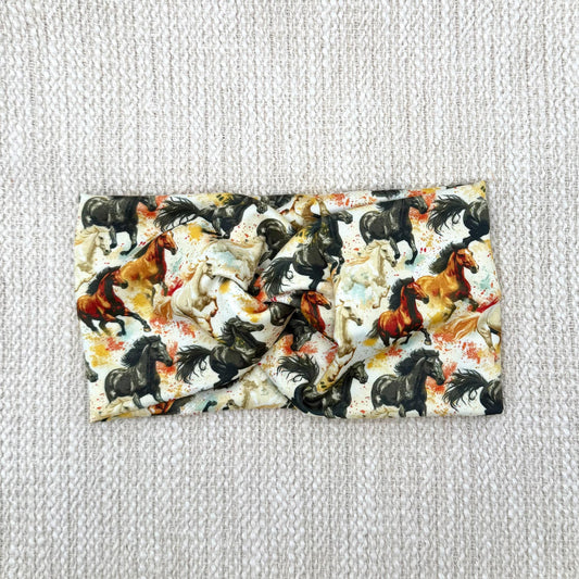 Wide, twisted headband with horse theme print.