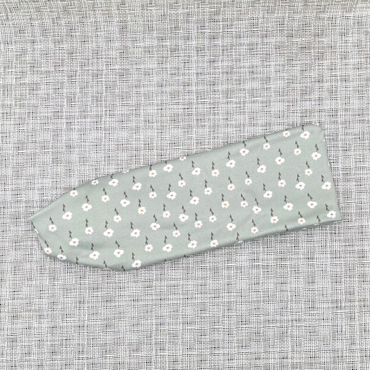 mint color headband with small white flowers