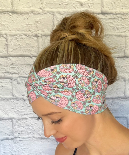 mint color headband with pink brains and flowers