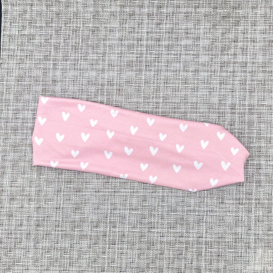 light pink headband with white hearts