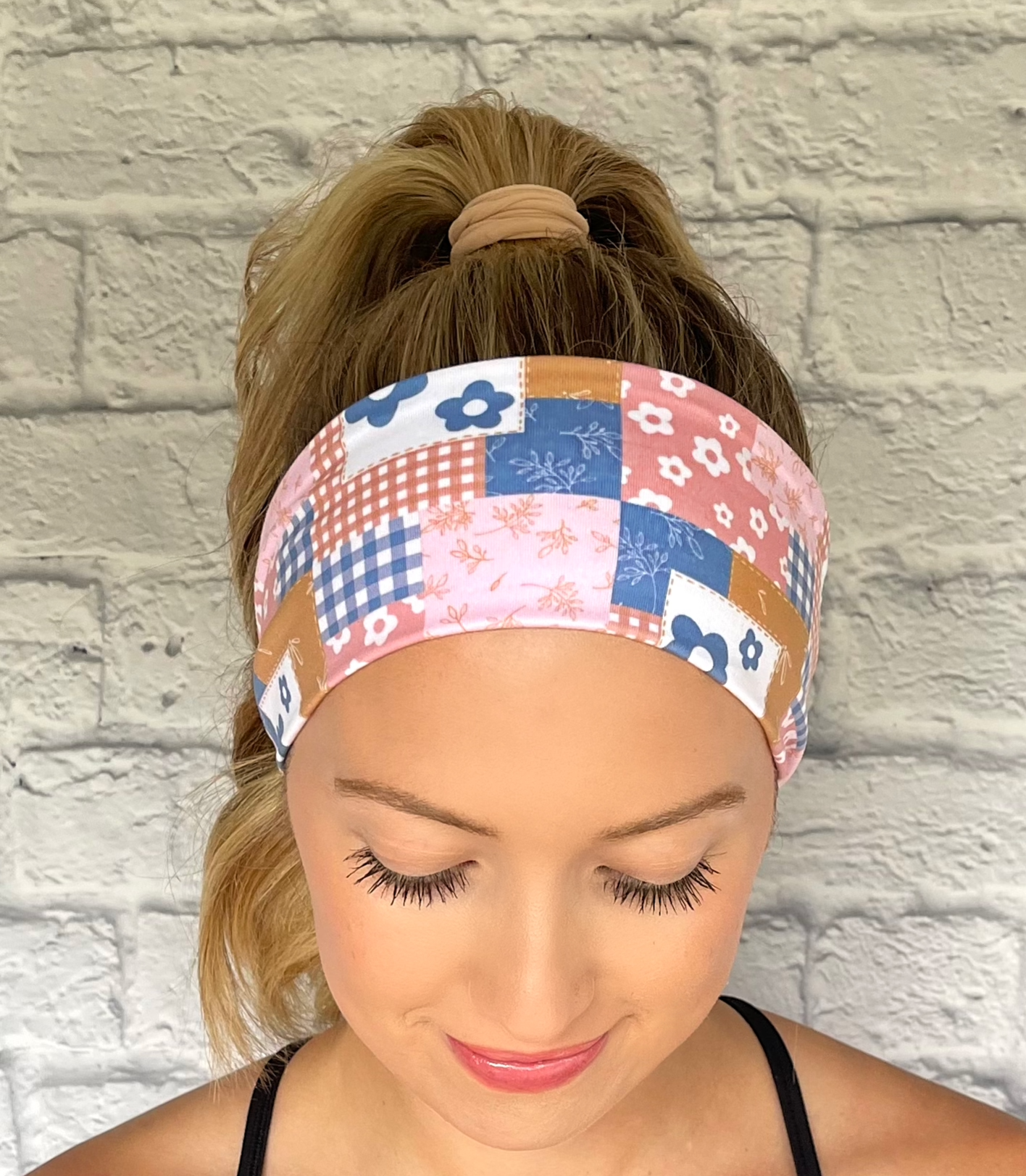 Pink and blue quilted pattern headband. Contains checker print with plaid, flowers, and checkers