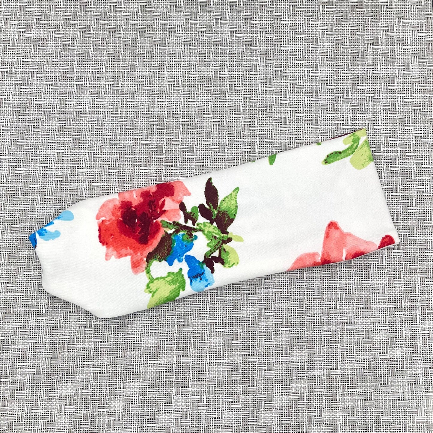 white headband with red and blue floral print