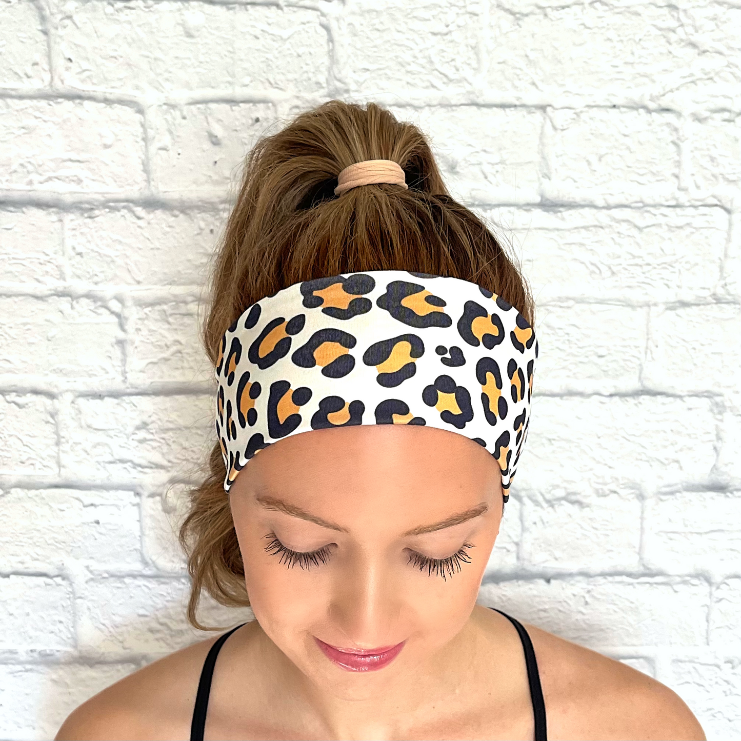 white headband with tan and black cheetah print