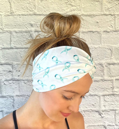 white headband with teal ribbon awareness