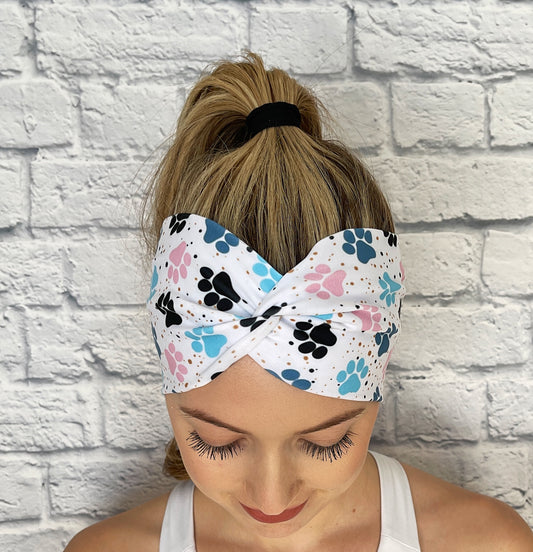 white headband with blue and pink dog paws