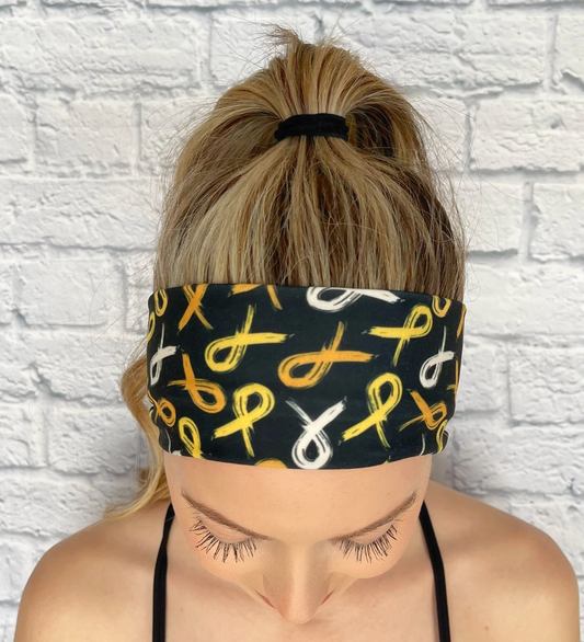 black headband with gold ribbon awareness