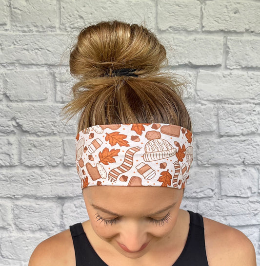 tan headband with orange scarves, leaves, hats, coffee, and boots