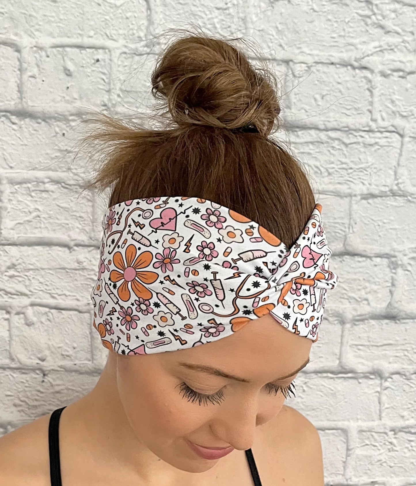 white headband with orange and pink flowers and medical theme print