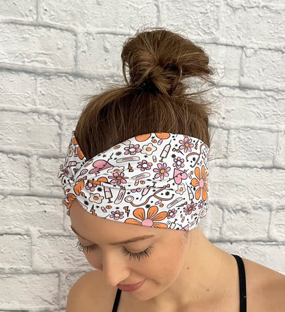 white headband with orange and pink flowers and medical theme print