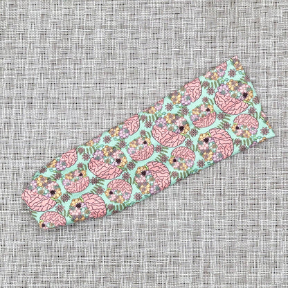 mint color fabric with brains and flowers