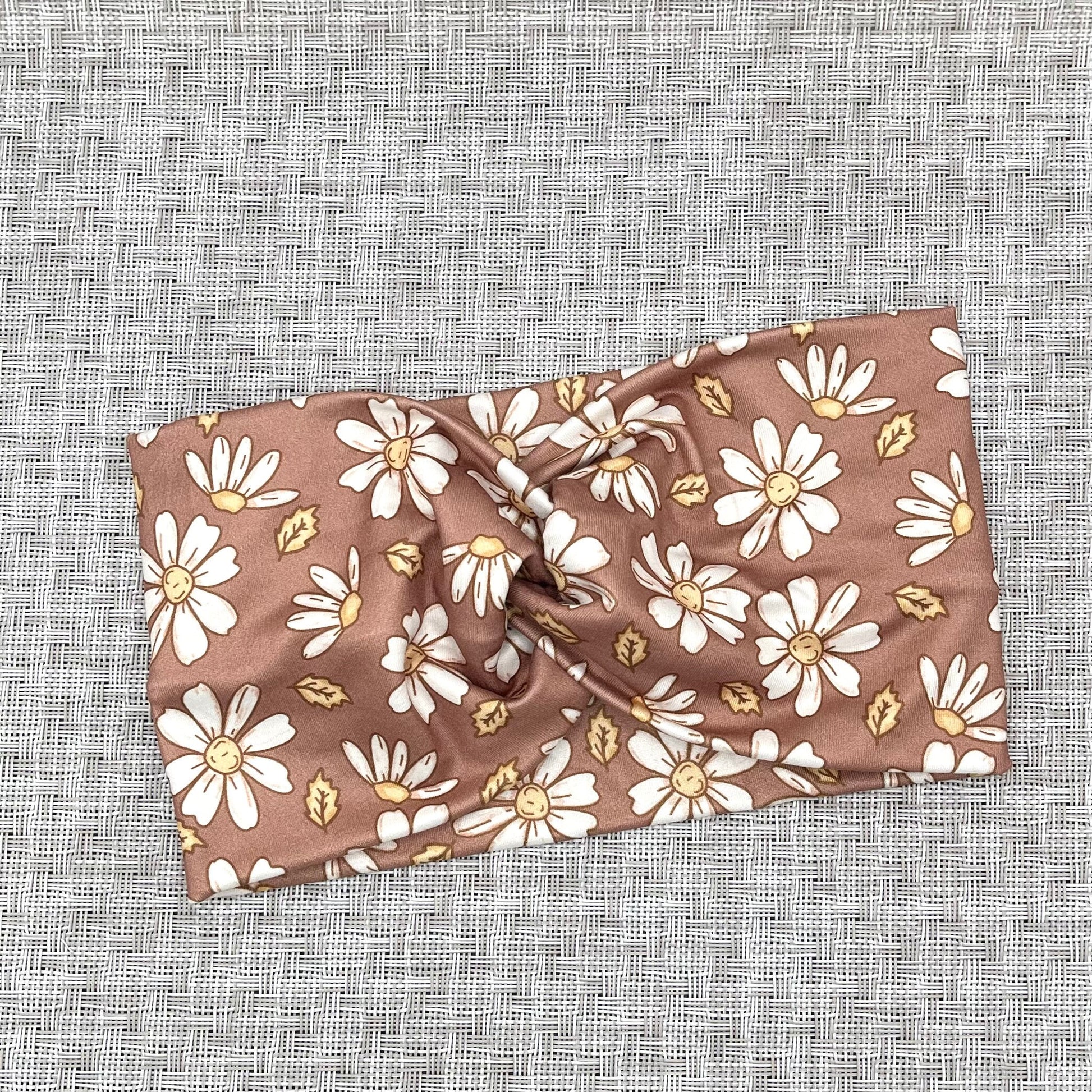 light brown headband with white flowers