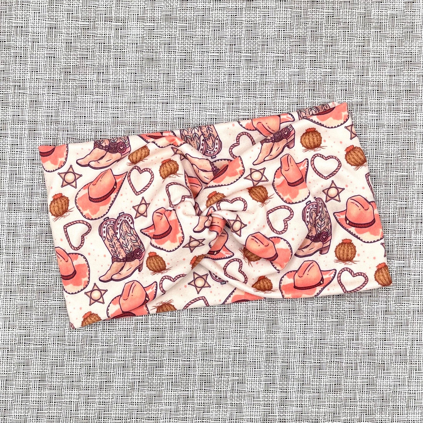 tan headband with pink cowgirl theme print