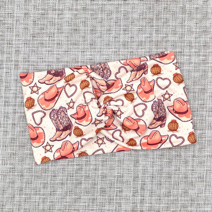 tan headband with pink cowgirl theme print